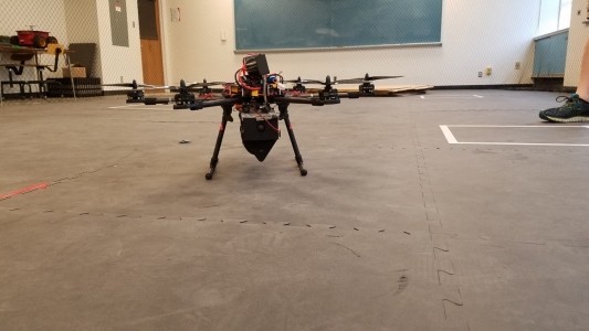 Multi rotor UAV sitting on ground in room