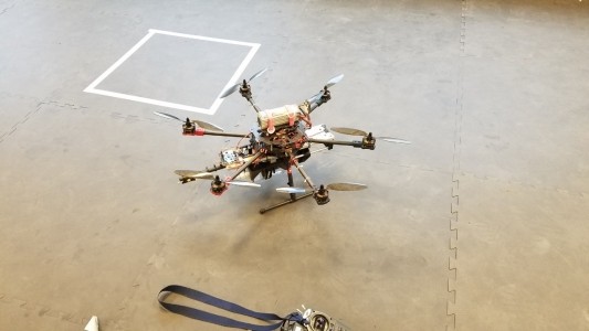 Multi rotor UAV sitting on ground in room