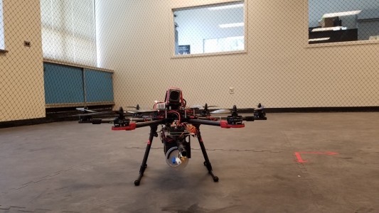 Multi rotor UAV sitting on ground in room