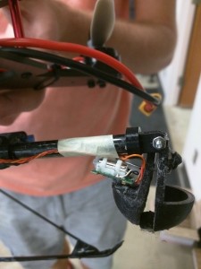 Arm on multi rotor UAV holding scoop of dirt