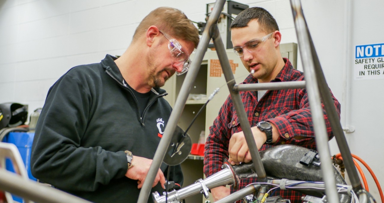 Student and professor working in lab