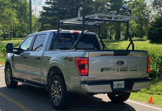 A pickup truck equipped with a system for rating infrastructure conditions