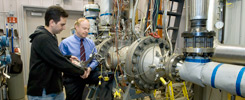 Student and mentor working on a combustor