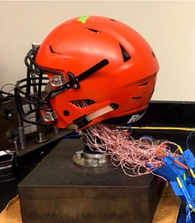 a football helmet with wires sticking out the back