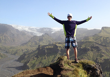 Isaac Feather, mechanical engineering class of 2017, pictured on the top of a large mountain while hiking!