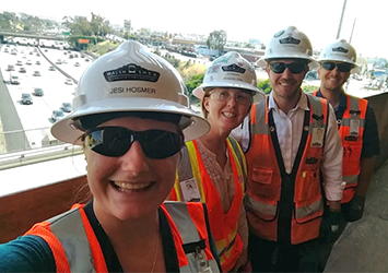 Jessica Hozmer, construction management class of 2018, in a neon safety vest, hardhat, and safety glasses while on co-op.