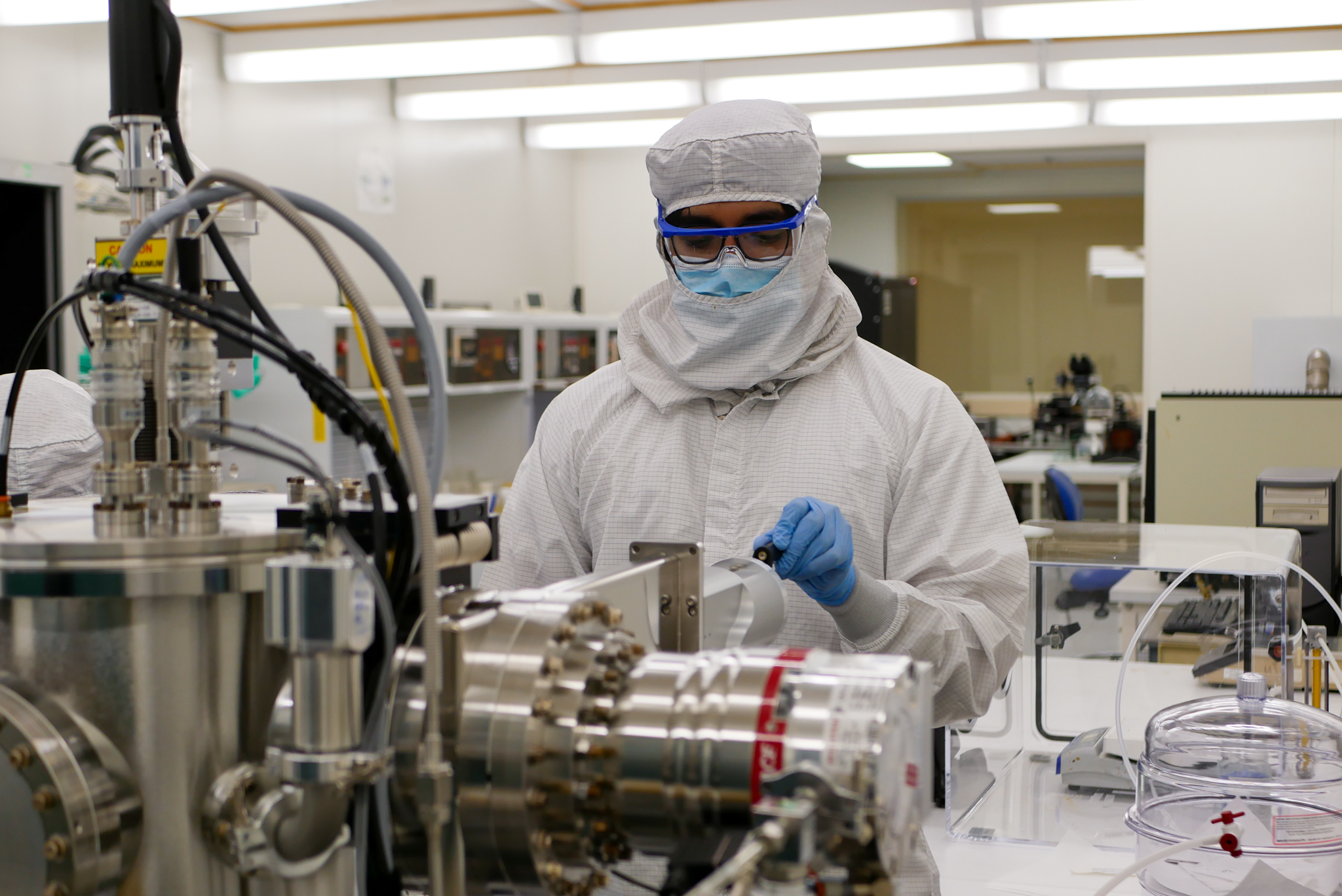 A person in the Cleanroom working with equipment 