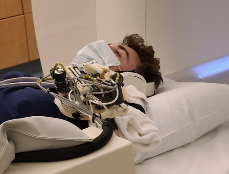Student in MRI machine